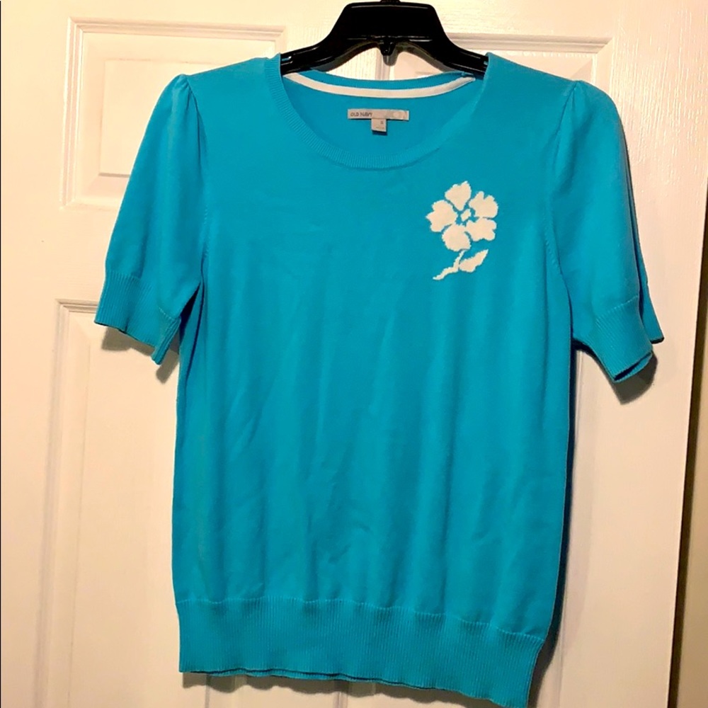 sweater top with flower detail